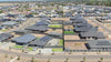 Video of new residential neighborhood with solar panels installed.